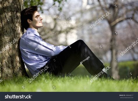 Businessman Leaning Against Tree Resting Stock Photo 408648217