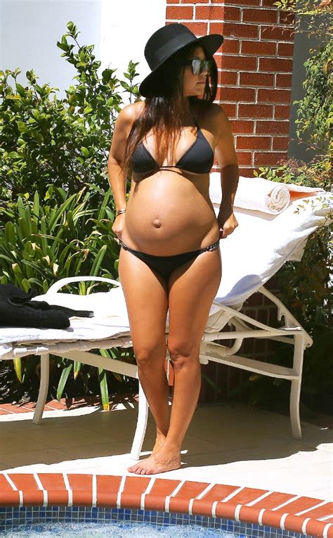 Pregnant Kourtney Kardashian Flaunts Her Glowing Baby Bump In Tiny