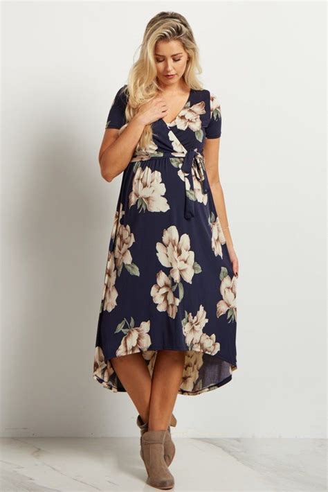 a floral short sleeve maternity midi dress featuring a wrap v neckline elastic cinching under