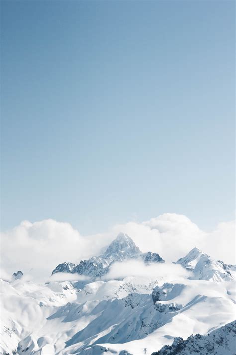 Snow Covered Mountain Under Blue Sky During Daytime Photo Free Image