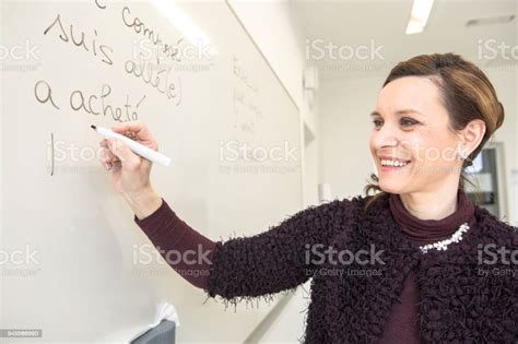 Beautiful Mature French English Teacher In Purple In The Classroom