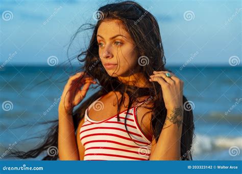 A Lovely Brunette Model Enjoys The Sunset While On Vacation In The YucatÃ¡n Peninsula Near