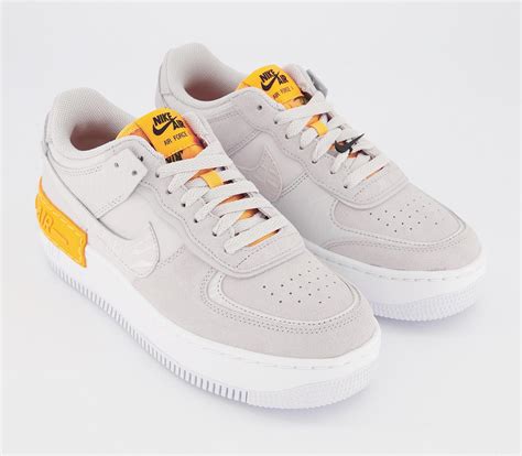 Originally released in '82 under the name 'air force' and designed by one of nike's top designers, bruce kilgore, the sneaker was initially released as a high top performance kick to up your. Nike Air Force 1 Shadow Trainers Vast Grey Vast Grey Laser ...