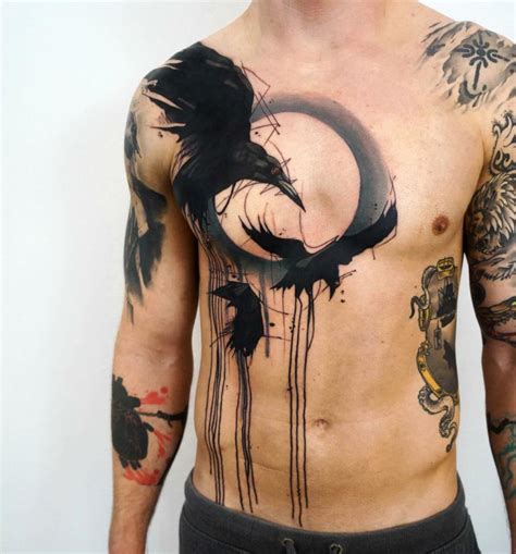 ravens abstract chest tattoo