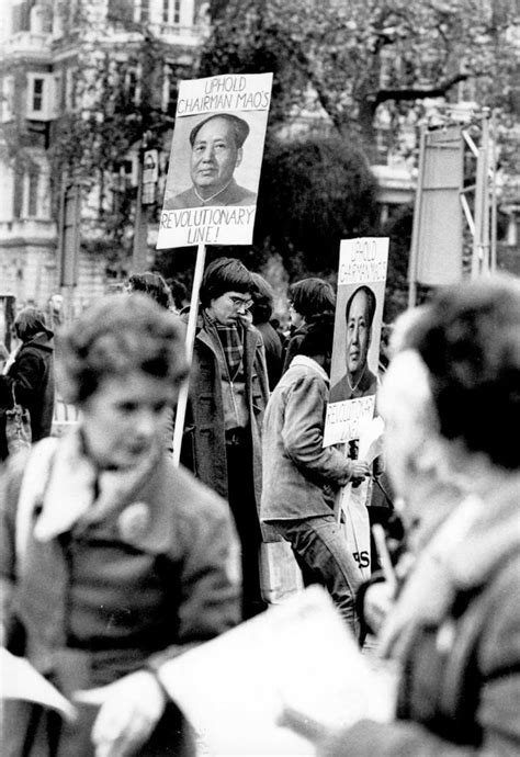 Demonstrators Holding Posters With Pictures Of Chairman Mao Tse Tung