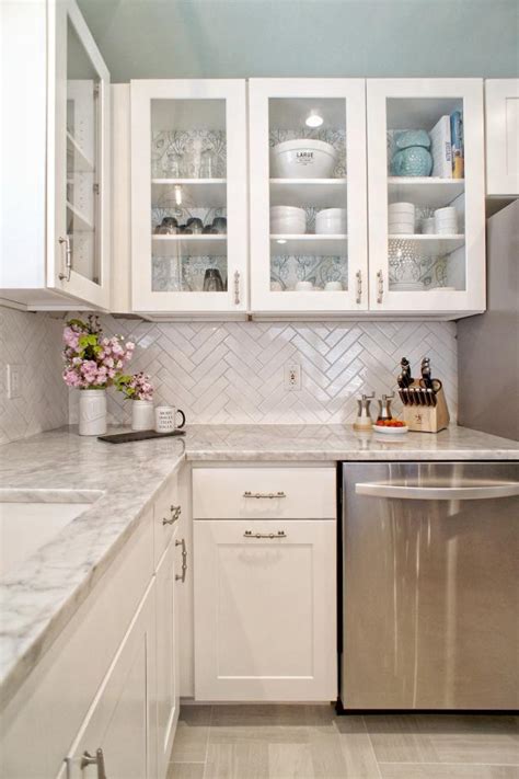 This white one flows seamlessly with the white cabinetry and light gray countertops and subway tile backsplash. The History of Subway Tile + Our Favorite Ways to Use It | HGTV's Decorating & Design Blog | HGTV
