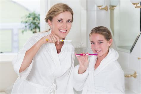 Happy Mother And Daughter Brushing Teeth Together Stock Image Image