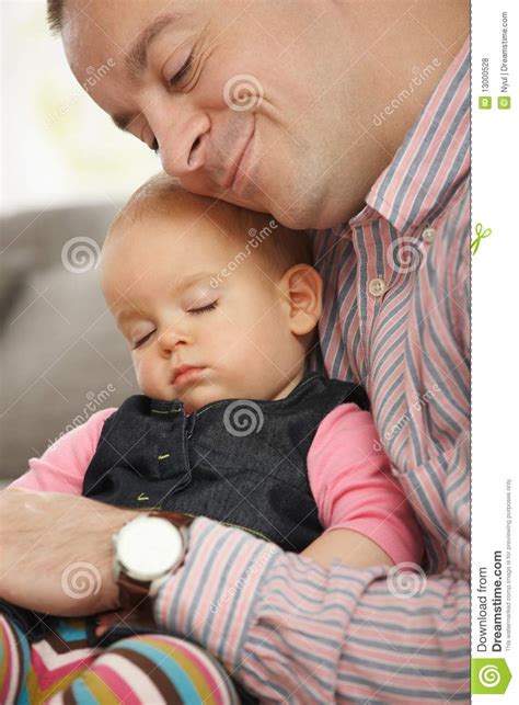 Baby Sleeping In Fathers Arm Royalty Free Stock Photos