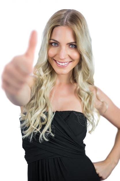 Premium Photo Smiling Gorgeous Blonde In Black Dress Thumbs Up