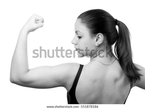 Muscular Young Fitness Girl Flexing Her Stock Photo 551878186