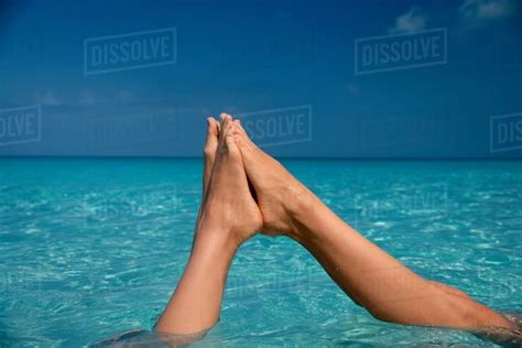 Feet Touching In Tropical Water Stock Photo Dissolve