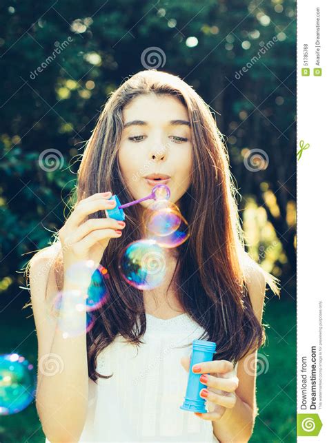 Girl Blowing Bubbles Outdoors Stock Photo Image Of Childish