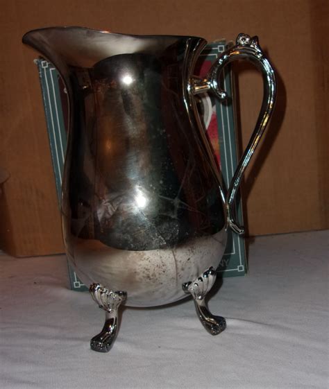 I got a great deal with the two. International Silver Company- Silverplated 2 quart water ...