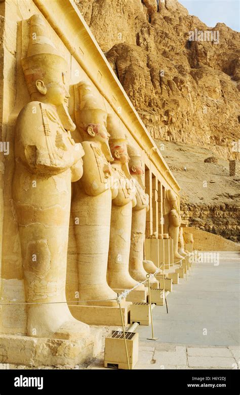 The Osirian Statues Of Hatshepsut Stands Next To Each Pillar At Her