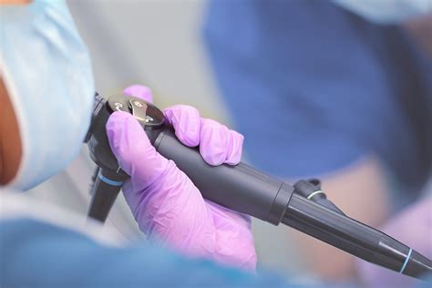 Endoscope In Doctor`s Hand During Medical Procedure Colon Rectal