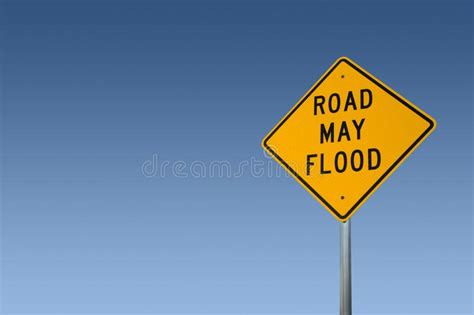 Road May Flood Sign Against A Clear Blue Sky Stock Image Image Of