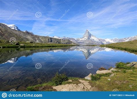 Beautiful Shot Of A Reflective Lake Surface On The Matterhorn Mountain
