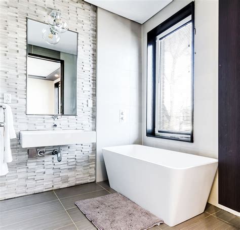 Sinks by kohler are cradled in washstands, also from urban archaeology, lending a modern touch. How To Create A Relaxing Bathroom ⋆ Nicola Says
