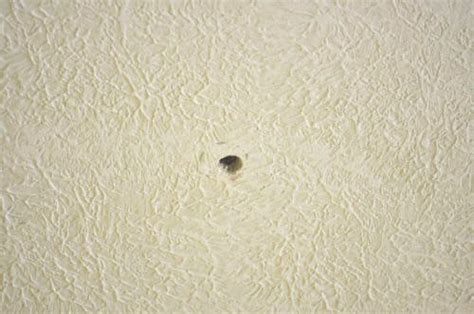 Why Are Small Holes Appearing In My Ceiling Small Random Holes