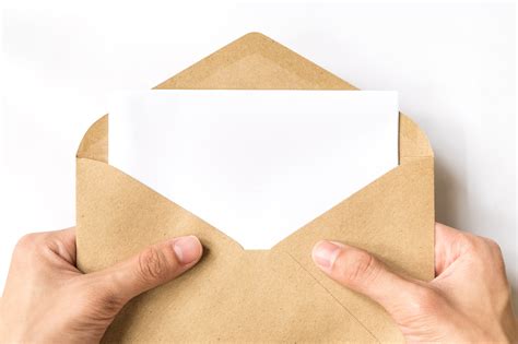 Hand Opening Brown Document Envelope With Copy Space Taking Control
