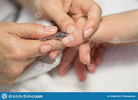 Close Up Finger Nail Care By Manicure Specialist In Beauty Salon Manicurist Clear Cuticle With