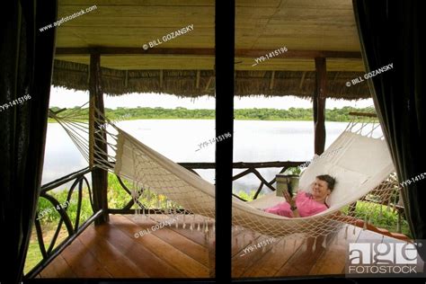 Woman Reading In Hammock Napo Wildlife Center Yasuni National Park Napo Province Ecuador