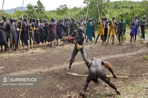 Stick Fighting Between Two Surma Warriors Ethiopia Superstock