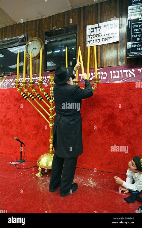 Orthodox Jewish Rabbi Lighting Hanukkah Hi Res Stock Photography And