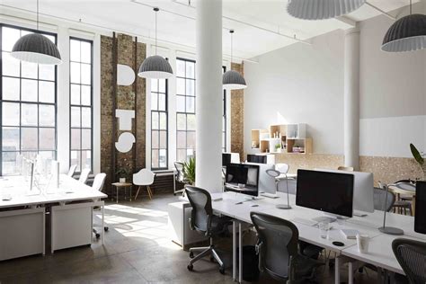 Muuto Lamps Draw Attention To The Tall Ceilings The Office Chairs Are