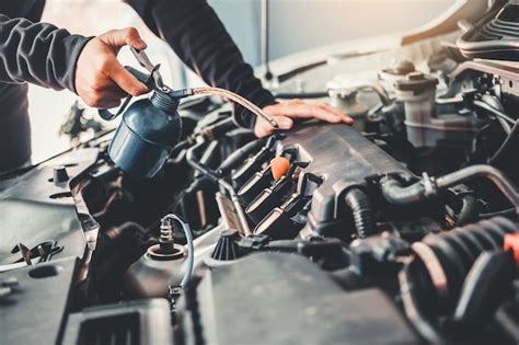 Premium Photo Technician Hands Of Car Mechanic Working In Auto Repair