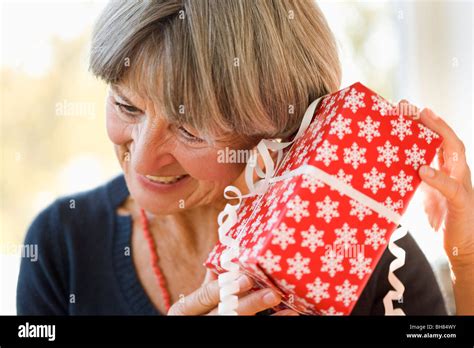 Old Woman Holding Ear Against Present Stock Photo Alamy