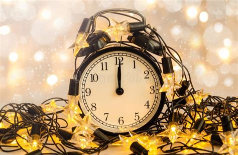 New Year Alarm Clock Wrapped Into Festive Star Garland Midnight Stock