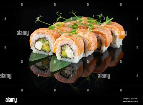 Traditional Delicious Fresh Sushi Roll Set On A Black Background With
