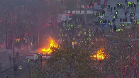 Police Use Tear Gas And Water Cannons On Fuel Protesters In Paris