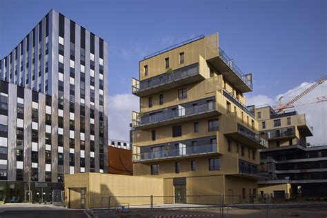 Inoxia Apartments Feature Jagged Wraparound Balconies Timber