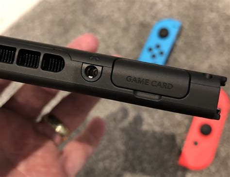 The microsd card slot is hidden behind the switch's stand. Nintendo Switch UK Tesco Bundle in Hands-on Review - Product Reviews Net