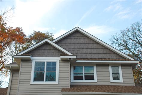 Shingles come in a variety of different looks from evenly spaced squares to irregular shakes, both of which are available in wood stains. Re-siding Your Home? Here's the Latest in Siding Trends!