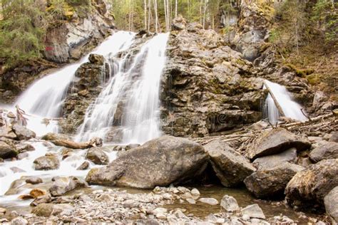 Smooth Waterfall In Forest Over Rocks Stock Photo Image Of Beautiful