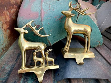 Two Vintage Heavy Brass Stocking Holders Reindeer Mismatched Gold Tone Christmas Decor Mantle