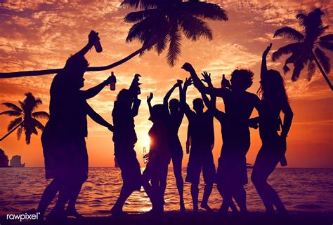 A Group Of Diverse People Is Having Fun At The Beach Premium Image By