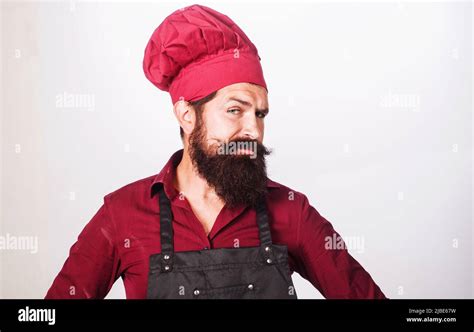 Bearded Cook Or Baker In Uniform Apron And Chef Hat Kitchen Advertising Cooking Food Concept
