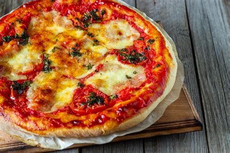 Italian Pizza With Tomatoes And Mozzarella Cheese Italian Cuisine