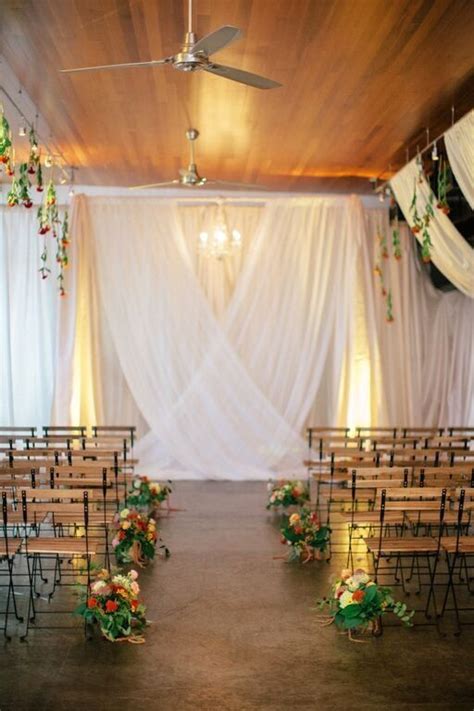Indoor Ceremony Backdrop With Draped Fabric And Hanging