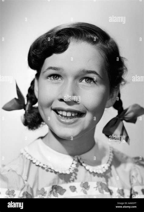 1950s Portrait Smiling Happy Girl Hair In Pigtails With Ribbon Bows