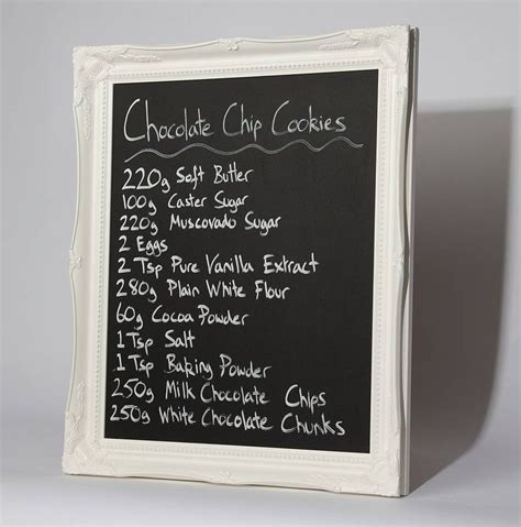 A Chalkboard Menu Board With Writing On The Front And Bottom Attached