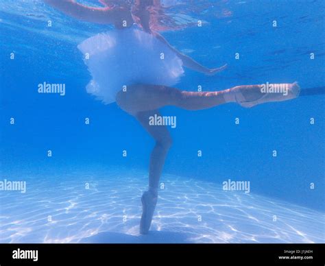 Underwater Dancer Beautiful Ballerina Dressed With Ballet Tutu And Shoes Dancing And