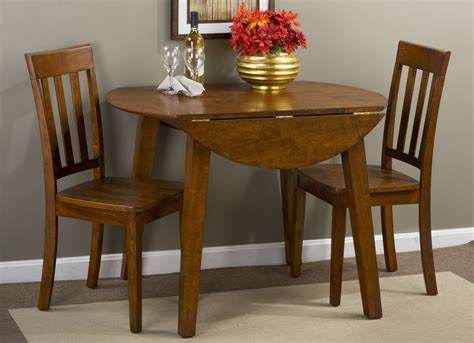 Simplicity Caramel Extendable Round Drop Leaf Dining Room Set From