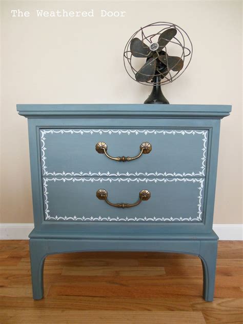 The end table features 3 spacious drawers for storing remotes, coasters, magazines and other household items. Blue nightstand with a little design - The Weathered Door