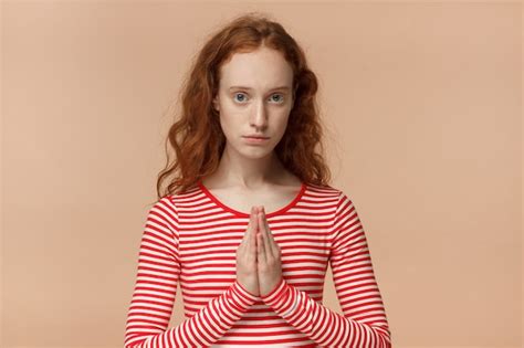 Premium Photo Redhead Girl Holding Hands In Begging Gesture Or Mudra