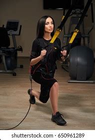 Brunette Girl Electrical Muscular Stimulation Suit Stock Photo